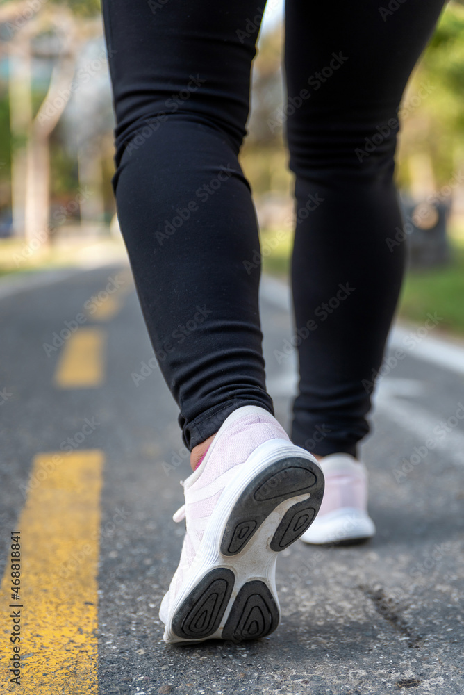 Beautiful and athletic Hispanic woman exercising at a city park Beautiful and athletic Hispanic woman exercising at a city park