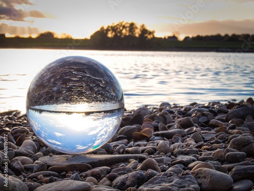 lens ball in front of a river