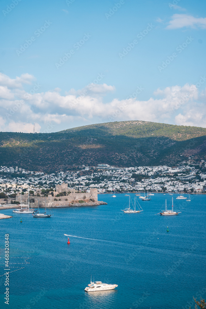 Seascape and natural background. The bay of the old town with yachts and boats in the sea.