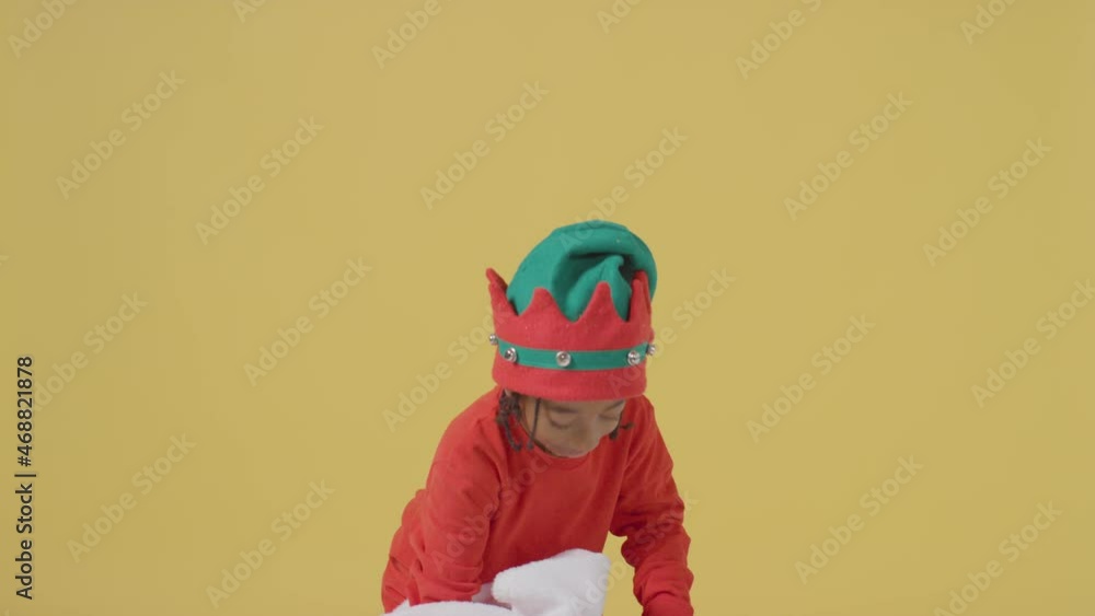 Young Boy Looking in Christmas Sack of Presents Young Boy Looking in Christmas Sack of Presents