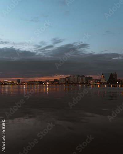 Evening lights in the city on the river