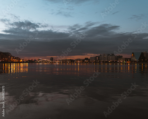 Evening lights in the city on the river