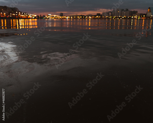 Evening lights in the city on the river