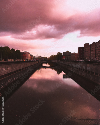 Sunset over the river in the city
