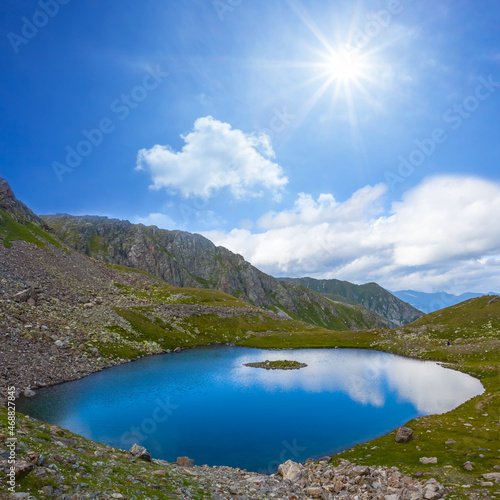 Fototapeta Naklejka Na Ścianę i Meble -  small blue lake in mountain valley at the sunny day