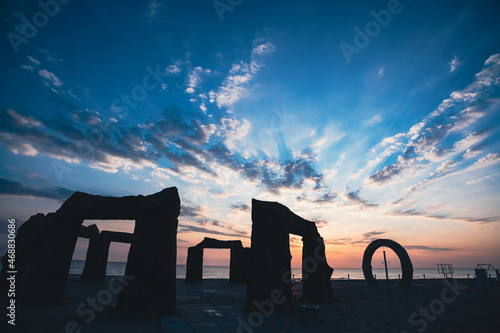 Abandoned Kazantip beach in the village of Popovka, Crimea, Russia. Beautiful sunset. The silhouettes of the stone gates imitate the ancient ones. The best place for trance and techno parties