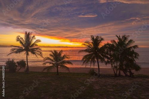 aerial view scenery sunset above coconut trees during colorful .cloud in sunset on Karon beach Phuket Thailand. .Scene of Colorful red light in the sky background.