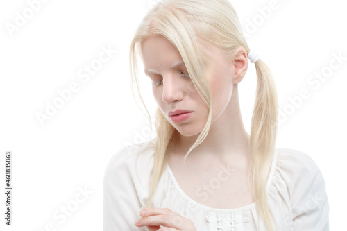 Gentle portrait of cute albino girl isolated on white background.