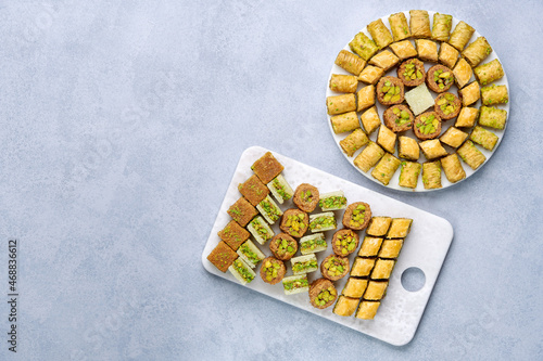 raditional turkish, arabic dessert baklava assortment with pistachio. Ramadan sweets. Top view, copy space photo