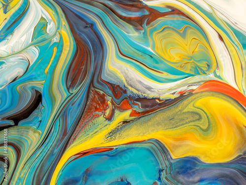 Abstract image of various colors of acrylic paint mixed together using a paint pouring technique