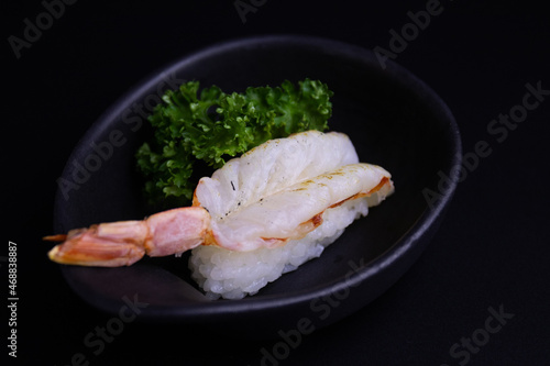 Traditional Japanese Food, Fresh Shrimp top on Rice, Ebi Nigiri Sushi , on Black Background