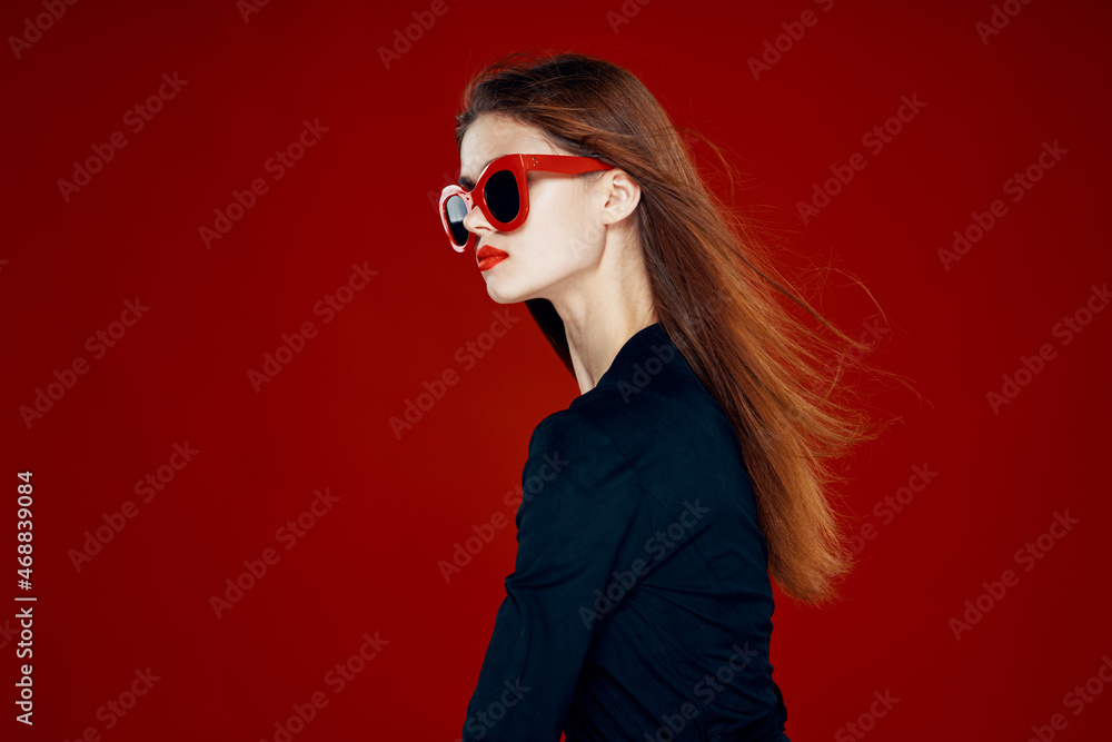 pretty woman wearing sunglasses fashion posing hairstyle red background pretty woman wearing sunglasses fashion posing hairstyle red background