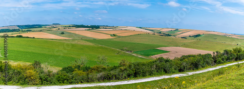 A panorama view of the patchwork fields on the South Downs above Worthing, Sussex in summertime