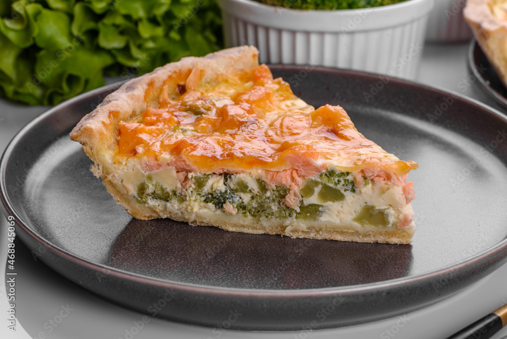 Delicious fresh quiche with broccoli, salmon and cheese