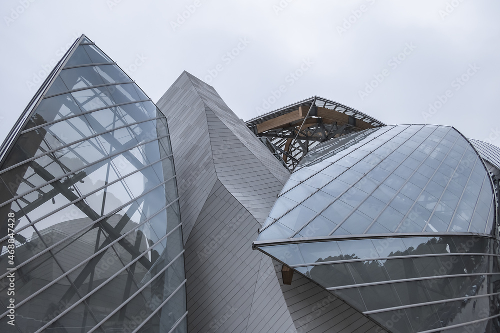 Modern architecture of Louis Vuitton Foundation (2014). Louis Vuitton  Foundation - art museum and cultural center. Fragments of Louis Vuitton  building design. PARIS, FRANCE. June 11, 2018. Stock Photo