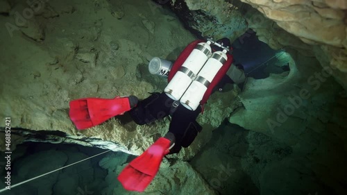 Budapest - 17 August 2017: Technical diver in red flippers in the underwater cave of Budapest photo