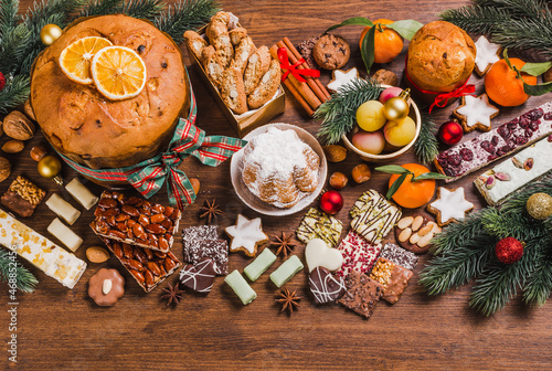 Christmas sweets background.Traditional Italian Christmas sweets on wooden background copy space.
