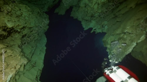 Budapest - 17 August 2017: Technical diver in red flippers in the underwater cave of Budapest photo