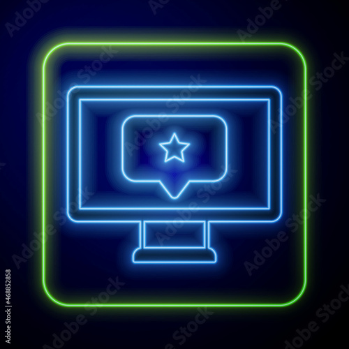 Glowing neon Monitor with star icon isolated on blue background. Favorite, best rating, award symbol. Vector