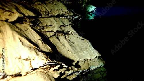 Budapest - 17 August 2017: Technical diver in red flippers in the underwater cave of Budapest photo