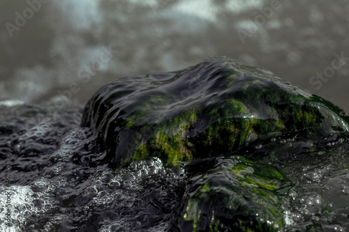 Moss-covered stone embraced by the waves