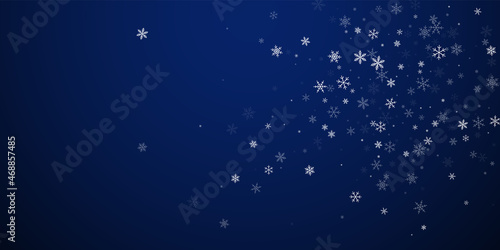 Sparse snowfall Christmas background. Subtle flyin