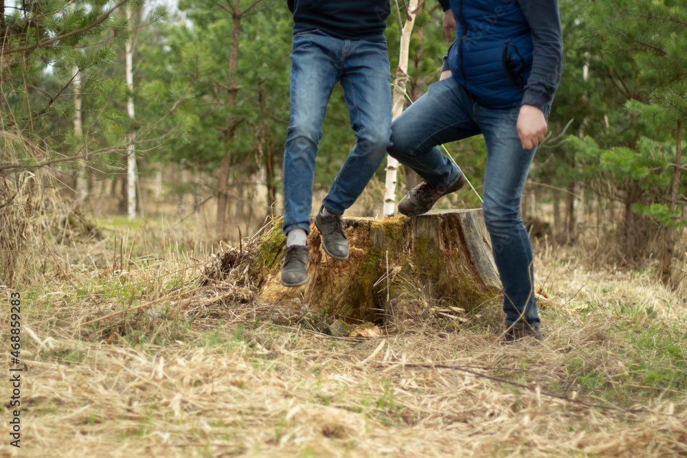 Two men in jeans. Fashion in clothes in autumn. Guys move freely. Two men in jeans. Fashion in clothes in autumn. Guys move freely.