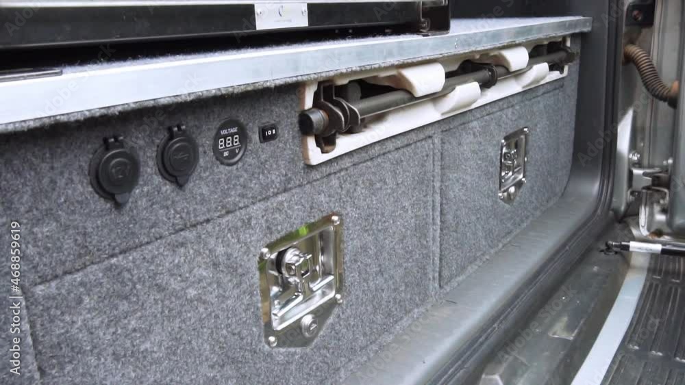 Storage compartment drawers in back of suv vehicle, medium shot Storage compartment drawers in back of suv vehicle, medium shot