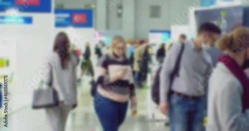 blurred defocused video. unrecognizable people in the lobby of a large modern building. business background.