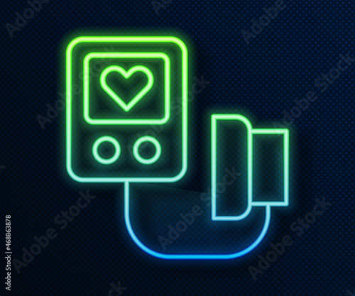Glowing neon line Blood pressure icon isolated on blue background. Vector