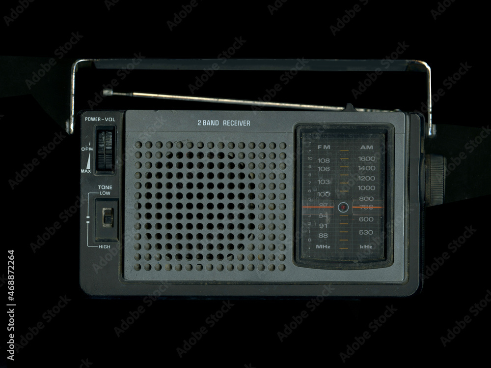 Fototapeta premium Old portable transistor Radio for emergency broadcasts. Black background. Scan Effect