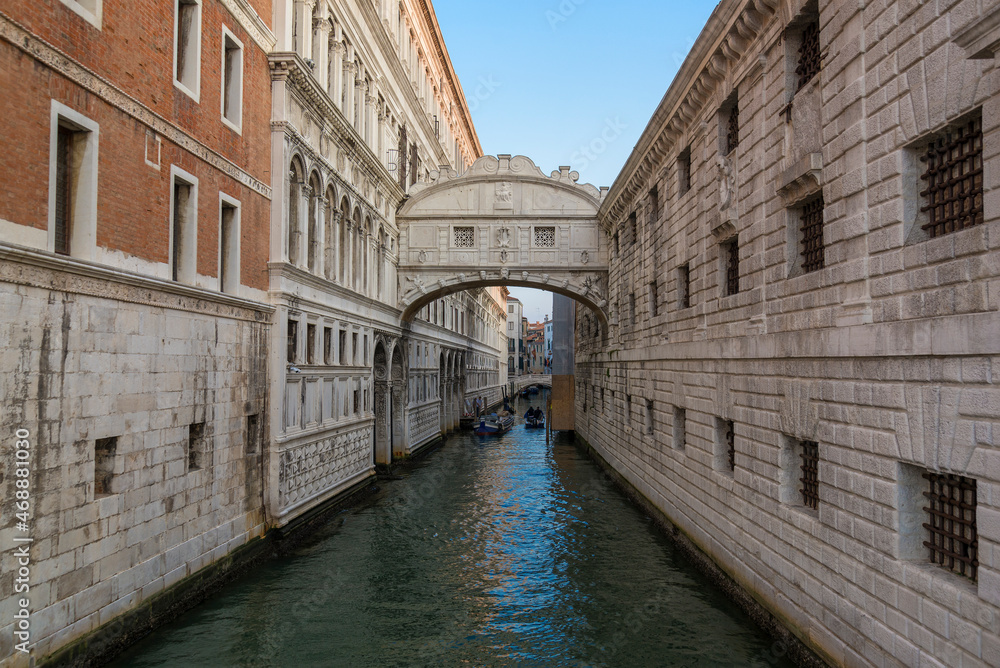 Old Bridge of Sighs (Ponte dei Sospiri) in the cityscape in the early morning. Venice, Italy