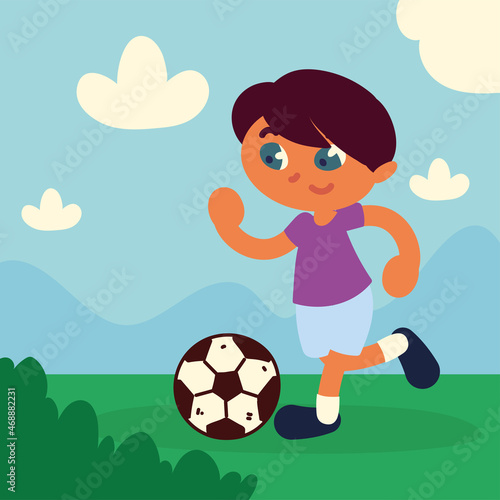 boy running with soccer ball