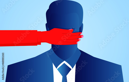 Businessman's mouth is blocked by red hands