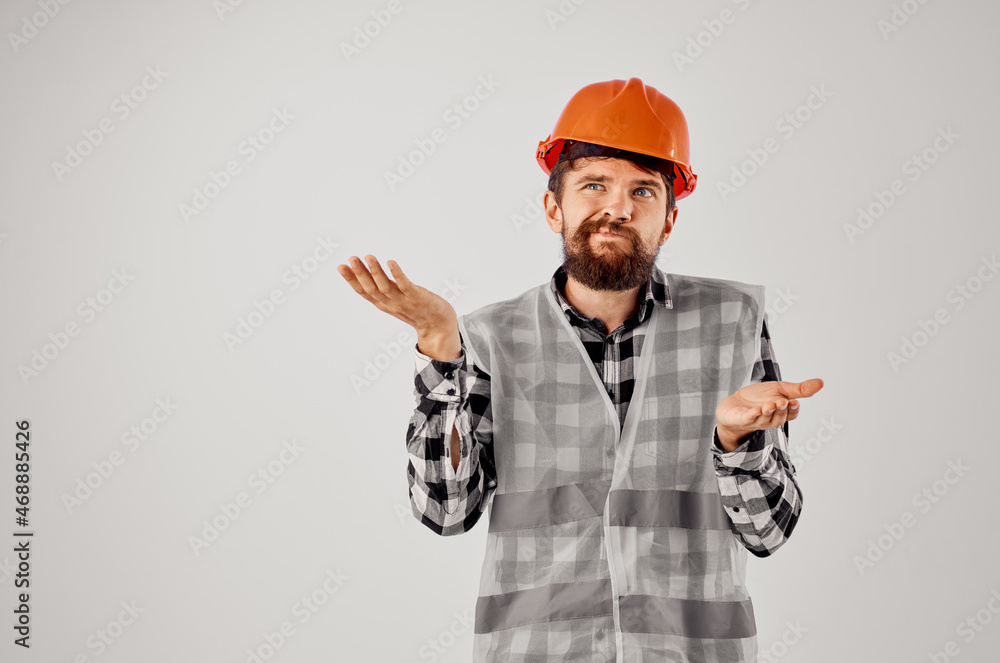 engineer in a gray vest construction work design light background engineer in a gray vest construction work design light background