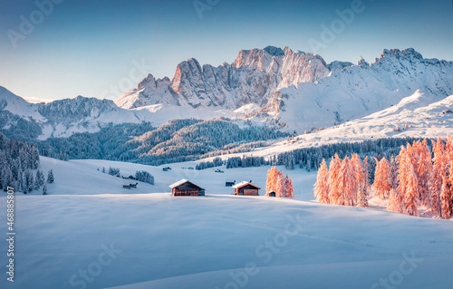 Captivating morning view of Alpe di Siusi village. Impressive winter scene of Dolomite Alps. Spectacular landscape of ski resort, Ityaly, Europe. Beauty of nature concept background. photo