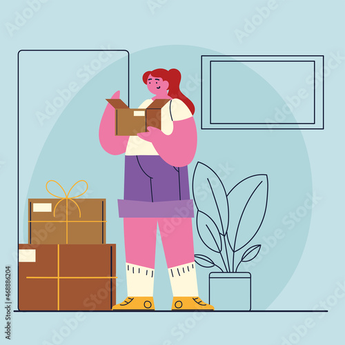 woman opening box at home