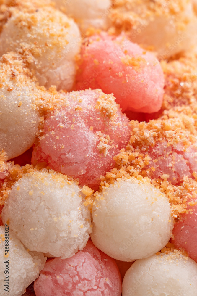 Deep-fried red and white tangyuan with peanut powder. Deep-fried red and white tangyuan with peanut powder.