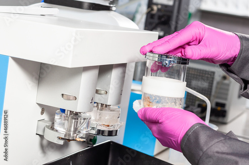 A food quality laboratory assistant does a chemical analysis. Assistant in the laboratory of of food quality.