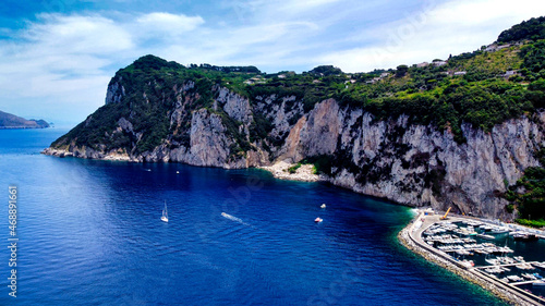 Beautiful coastline of Capri along the port area. Aerial view from drone.