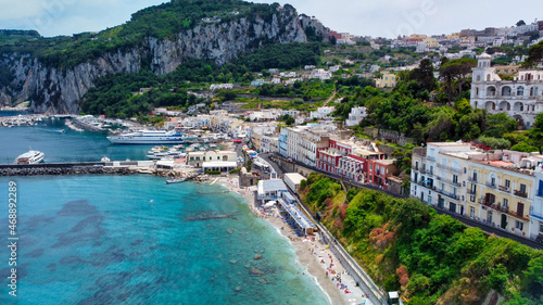 Beautiful coastline of Capri along the port area. Aerial view from drone. © jovannig