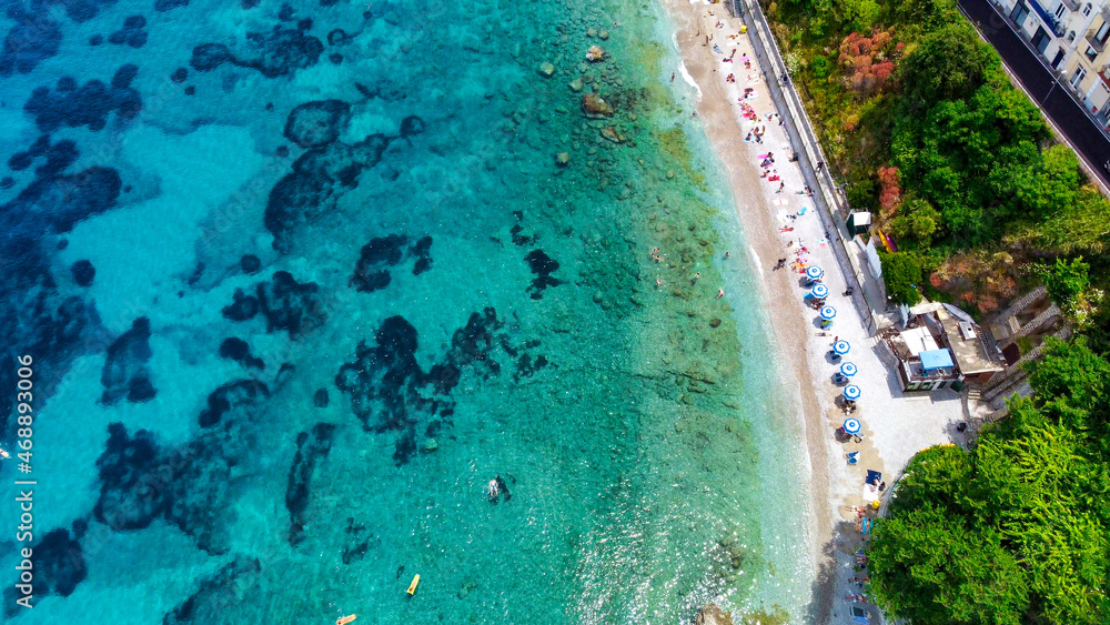 Overhead aerial view of beautiful mediterranean beach and coastline in summer season. Travel concept