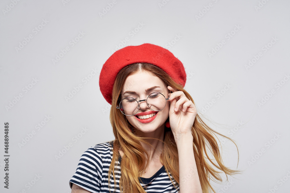 cheerful woman wearing a red hat makeup France Europe fashion posing Fresh air cheerful woman wearing a red hat makeup France Europe fashion posing Fresh air