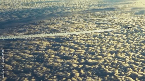 The plane is flying with an inversion trail