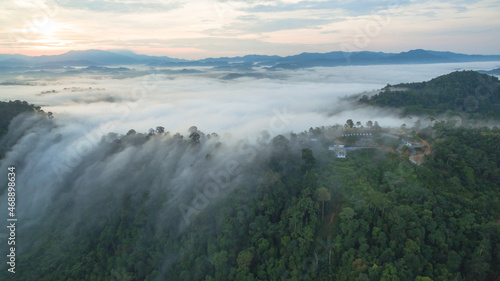 aerial view mist above the mountain in tropical rainforest and .beautiful sunrise scenery view in Phang Nga valley.