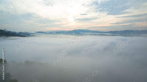 aerial view mist above the mountain in tropical rainforest and .beautiful sunrise scenery view in Phang Nga valley.