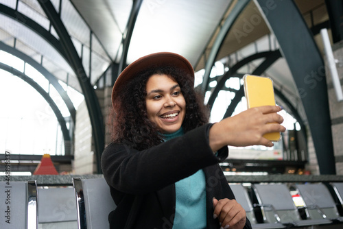 woman doing selfie in departure area
