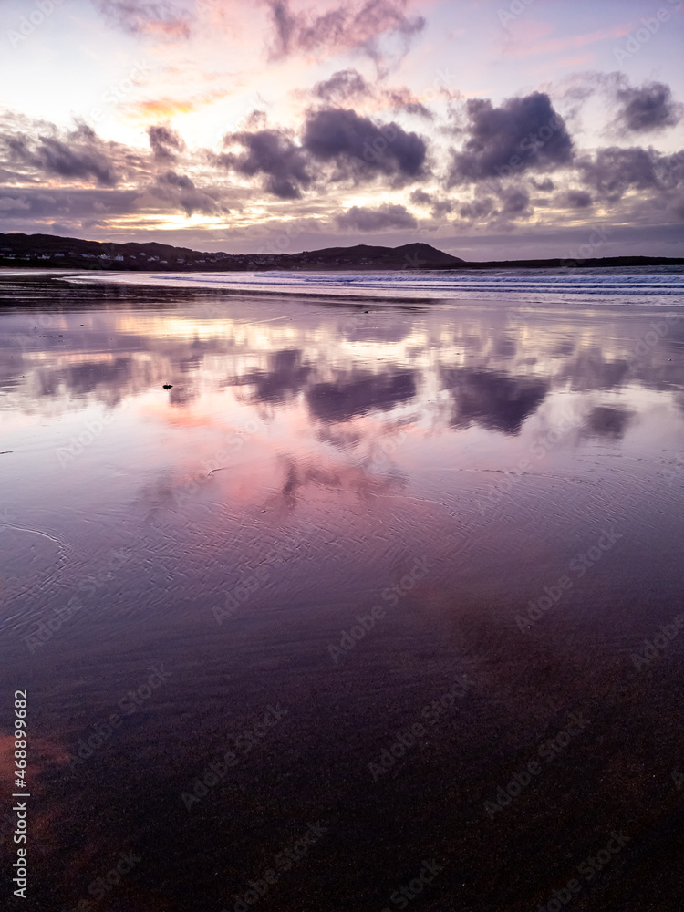 Fototapeta premium Dramatic sunset at Narin Strand by Portnoo, County Donegal in Ireland.