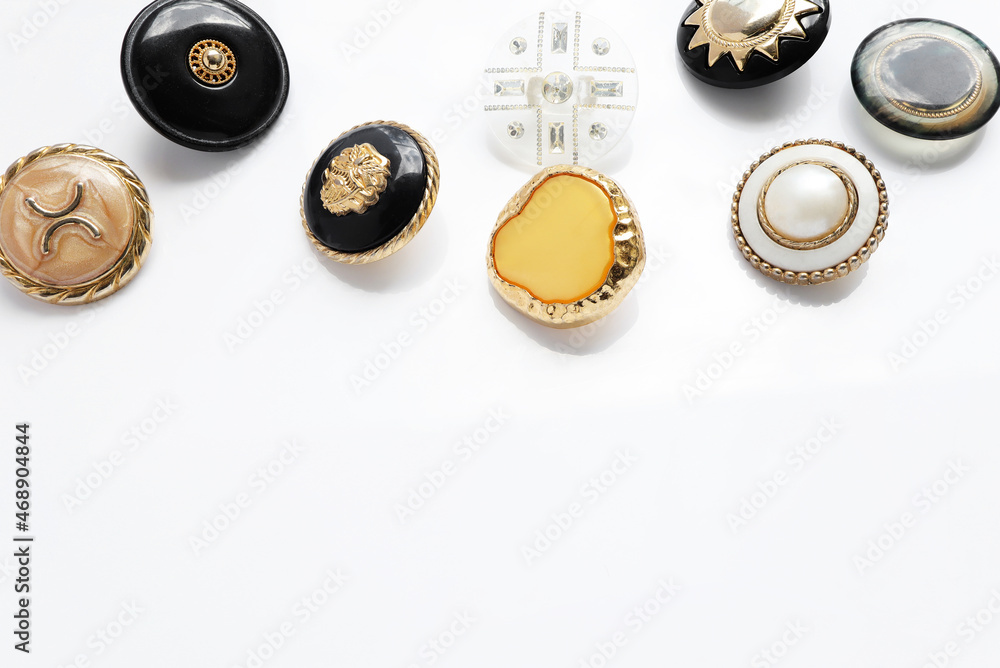 old sewing buttons, Close up of vintage gold buttons for sewing on white background. Craft, needlework concept. 