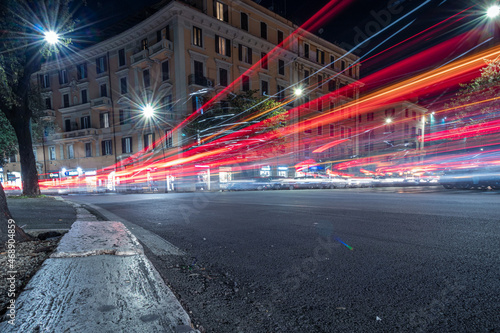 Cool long exposure cars traffic light trails, night view of the city of Rome 